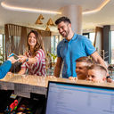Family checking into hotel
